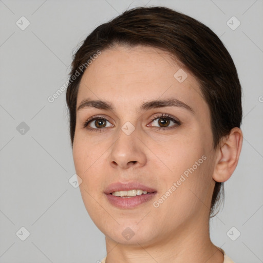 Joyful white young-adult female with short  brown hair and brown eyes