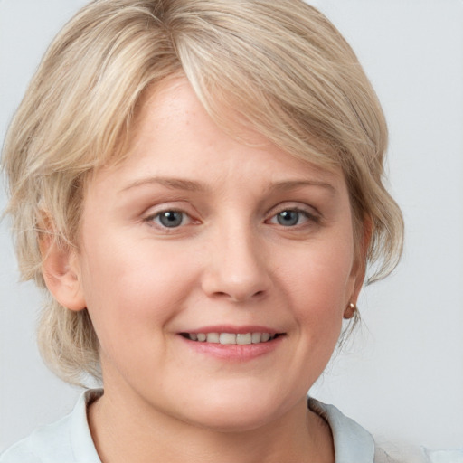 Joyful white young-adult female with medium  blond hair and blue eyes