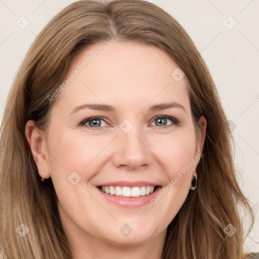 Joyful white young-adult female with long  brown hair and grey eyes