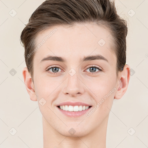 Joyful white young-adult male with short  brown hair and grey eyes