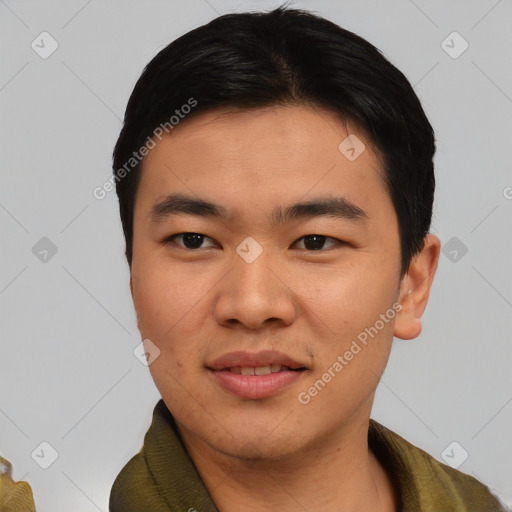 Joyful asian young-adult male with short  black hair and brown eyes