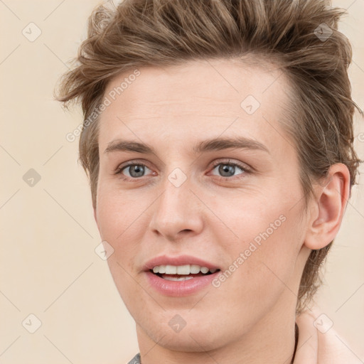 Joyful white young-adult female with short  brown hair and grey eyes