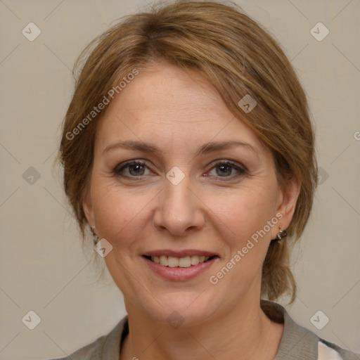 Joyful white adult female with medium  brown hair and grey eyes