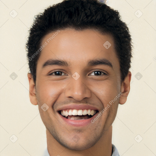 Joyful latino young-adult male with short  black hair and brown eyes