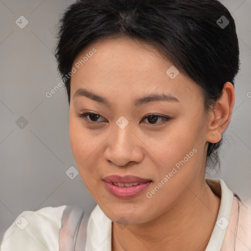 Joyful asian young-adult female with medium  brown hair and brown eyes