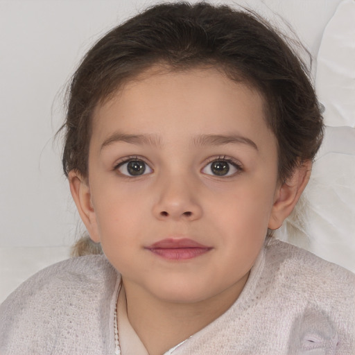 Joyful white child female with short  brown hair and brown eyes