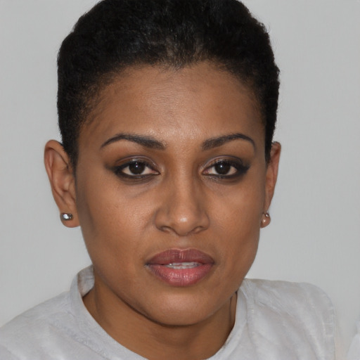 Joyful black young-adult female with short  brown hair and brown eyes