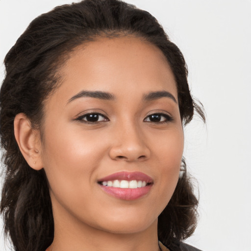 Joyful white young-adult female with long  brown hair and brown eyes