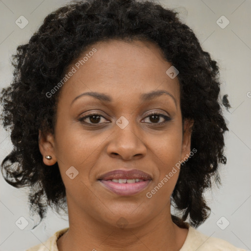 Joyful black adult female with medium  brown hair and brown eyes