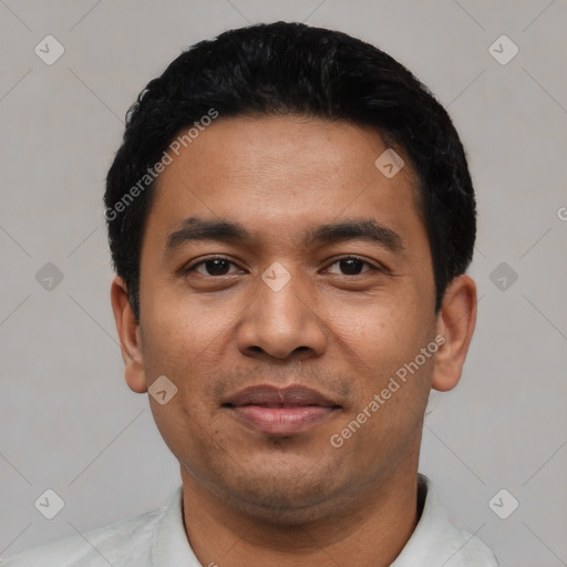 Joyful latino young-adult male with short  black hair and brown eyes