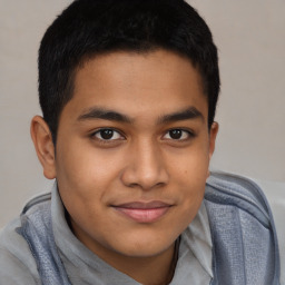 Joyful latino young-adult male with short  brown hair and brown eyes