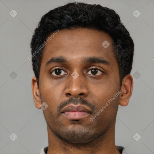Neutral black young-adult male with short  black hair and brown eyes