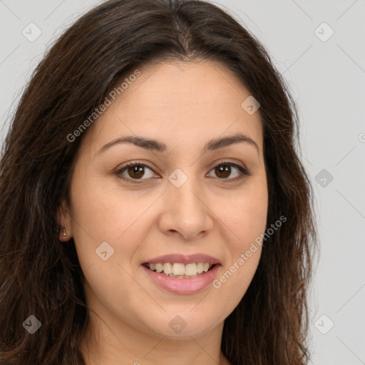 Joyful white young-adult female with long  brown hair and brown eyes