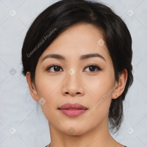 Joyful asian young-adult female with medium  black hair and brown eyes