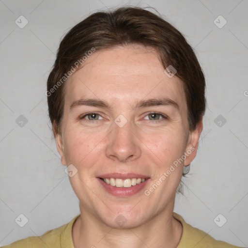 Joyful white adult female with medium  brown hair and brown eyes