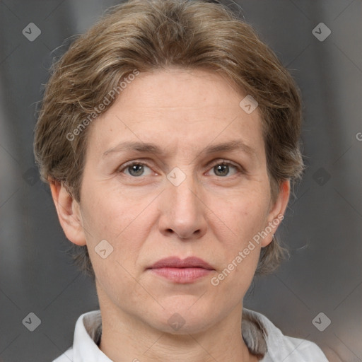 Joyful white adult female with short  brown hair and grey eyes