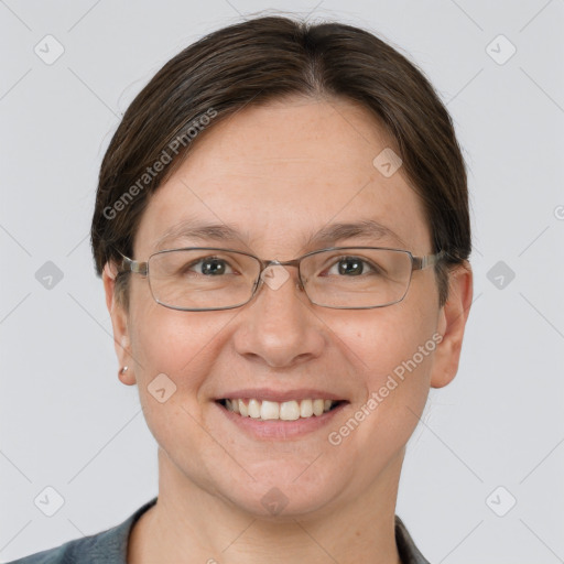 Joyful white adult female with short  brown hair and grey eyes