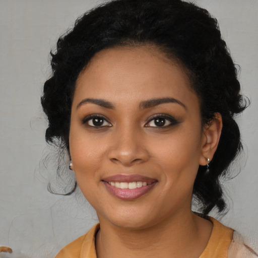 Joyful latino young-adult female with medium  black hair and brown eyes