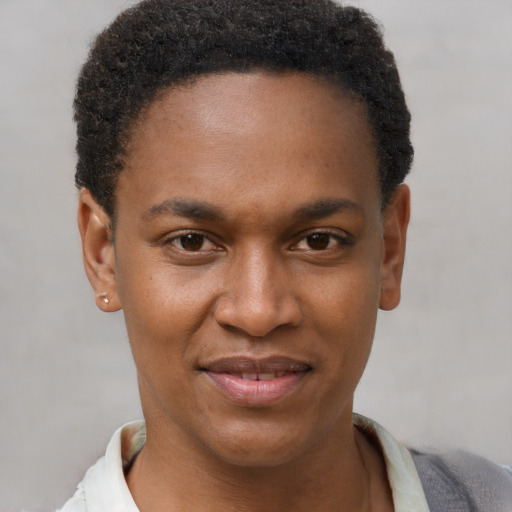 Joyful black young-adult male with short  brown hair and brown eyes