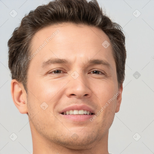 Joyful white adult male with short  brown hair and brown eyes