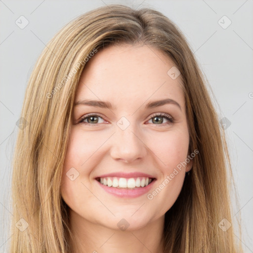 Joyful white young-adult female with long  brown hair and green eyes