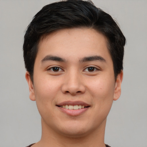 Joyful asian young-adult male with short  brown hair and brown eyes