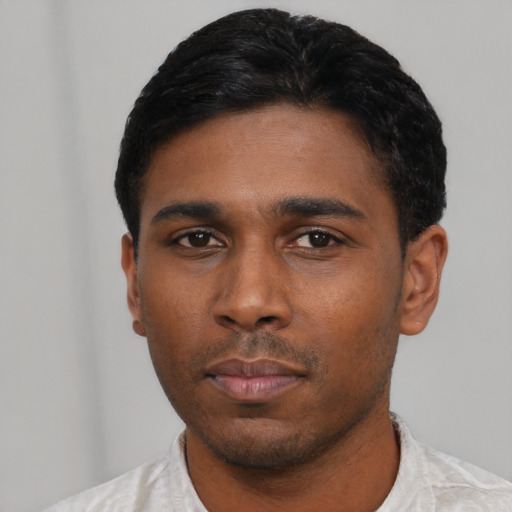 Neutral latino young-adult male with short  black hair and brown eyes