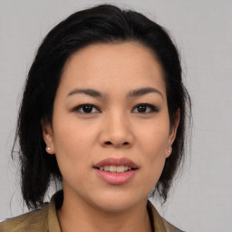 Joyful asian young-adult female with medium  black hair and brown eyes