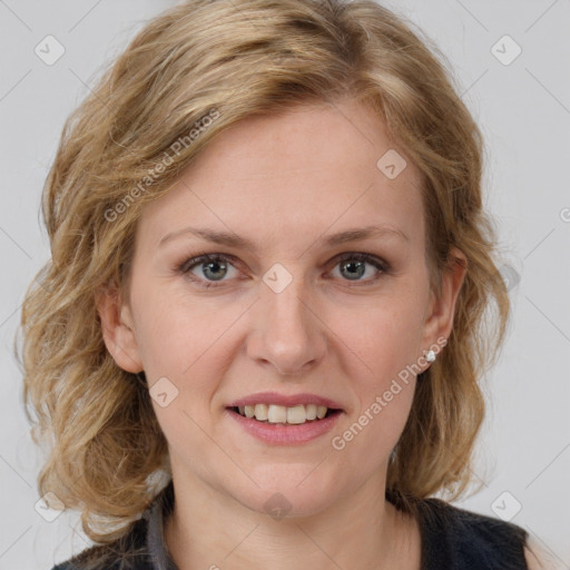 Joyful white young-adult female with medium  brown hair and blue eyes