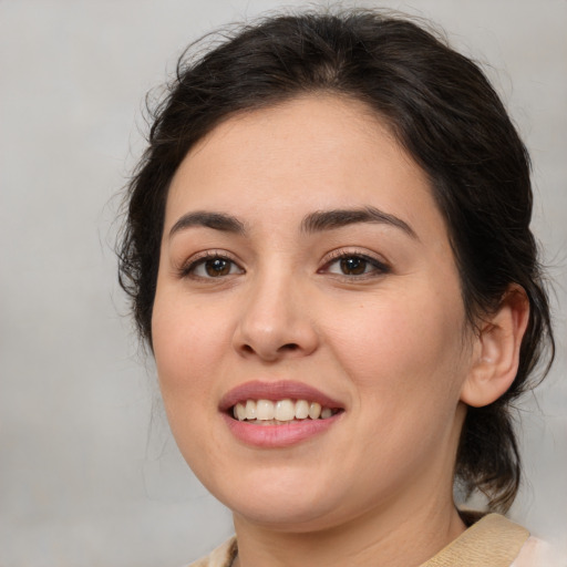 Joyful white young-adult female with medium  brown hair and brown eyes