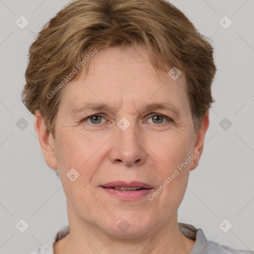 Joyful white adult female with short  brown hair and grey eyes