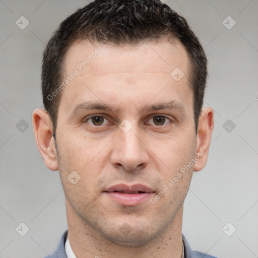 Joyful white adult male with short  brown hair and brown eyes