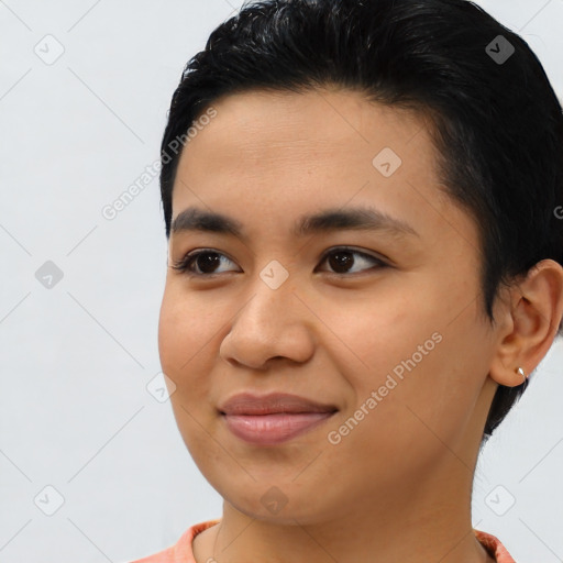 Joyful asian young-adult female with short  black hair and brown eyes