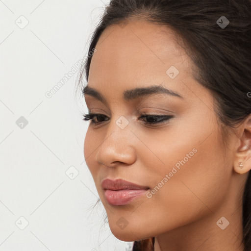 Joyful latino young-adult female with long  brown hair and brown eyes