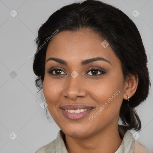 Joyful black young-adult female with medium  brown hair and brown eyes