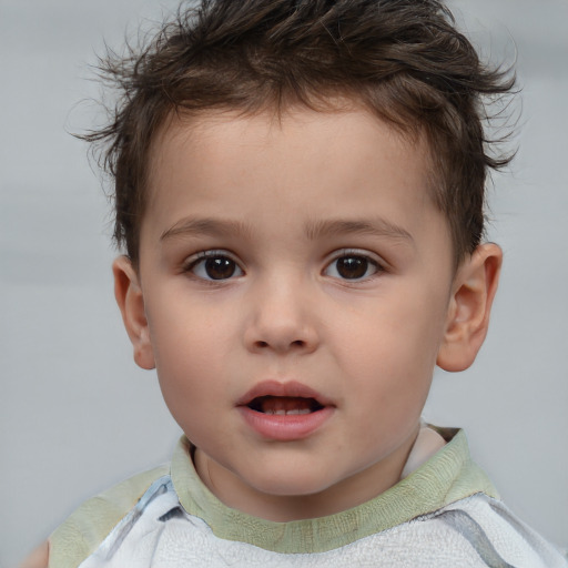 Joyful white child male with short  brown hair and brown eyes