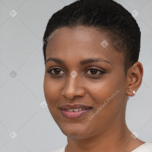 Joyful black young-adult female with short  brown hair and brown eyes