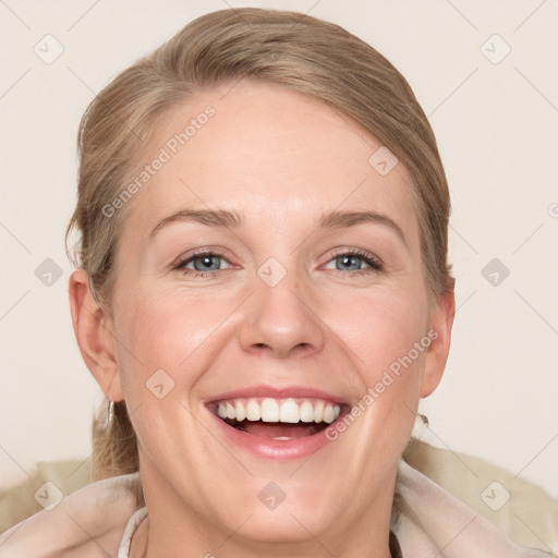 Joyful white adult female with medium  brown hair and grey eyes