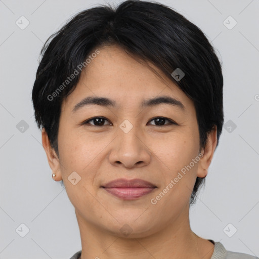 Joyful asian young-adult female with short  brown hair and brown eyes