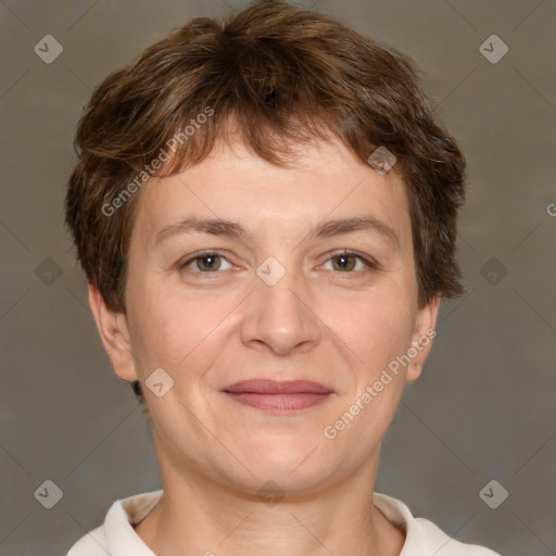 Joyful white adult female with short  brown hair and brown eyes