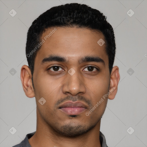 Neutral latino young-adult male with short  black hair and brown eyes