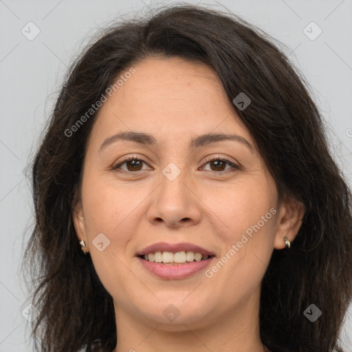 Joyful white adult female with long  brown hair and brown eyes