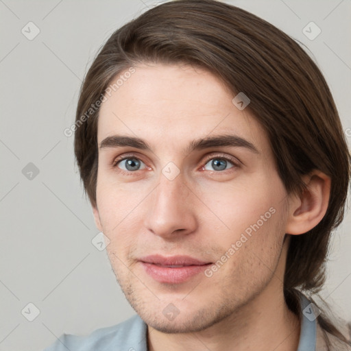 Neutral white young-adult male with short  brown hair and grey eyes