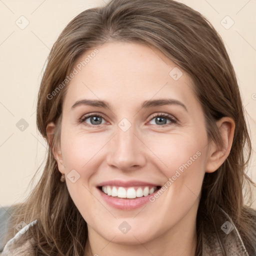 Joyful white young-adult female with long  brown hair and grey eyes