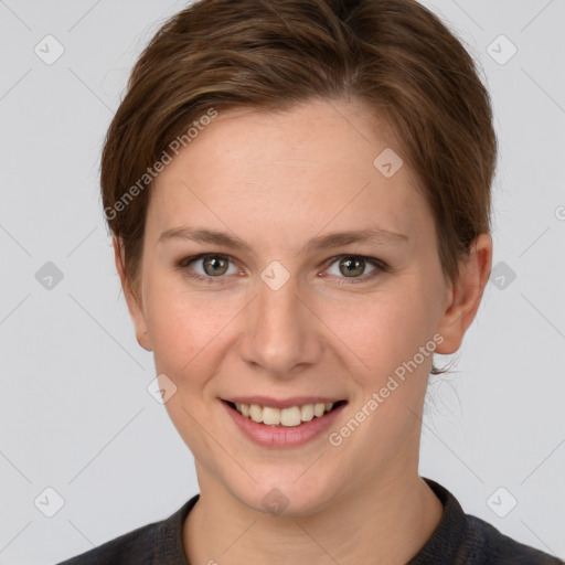 Joyful white young-adult female with short  brown hair and grey eyes