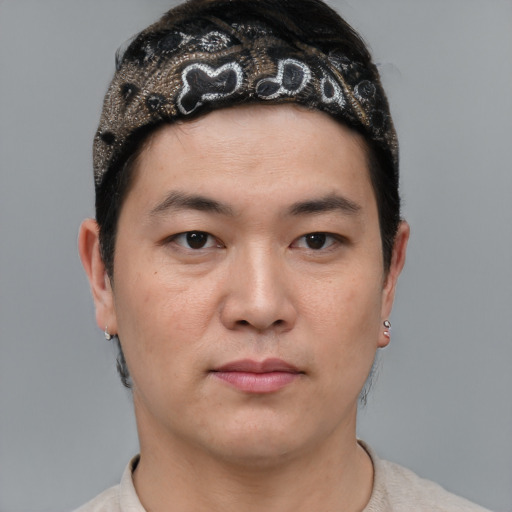 Neutral asian young-adult male with short  brown hair and brown eyes