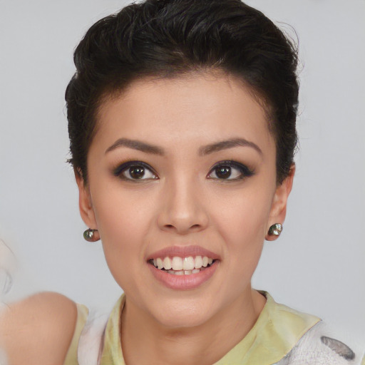 Joyful asian young-adult female with short  brown hair and brown eyes