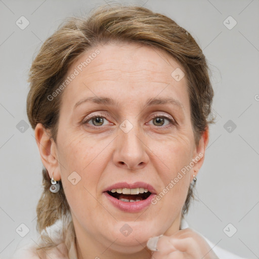 Joyful white adult female with medium  brown hair and grey eyes