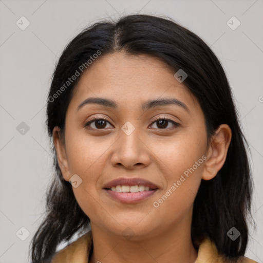 Joyful latino young-adult female with medium  brown hair and brown eyes