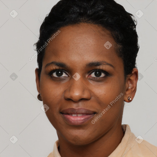 Joyful black young-adult female with short  black hair and brown eyes